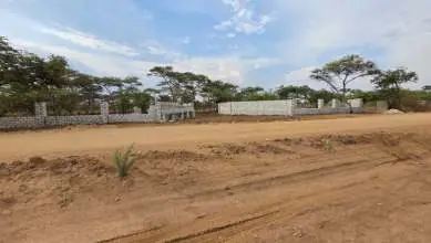 Perimeter wall fence on an open plot