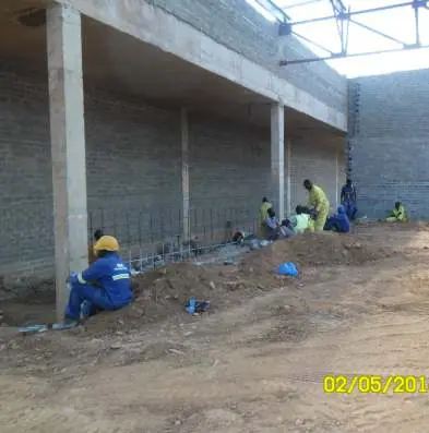 Crew working along a commercial block wall
