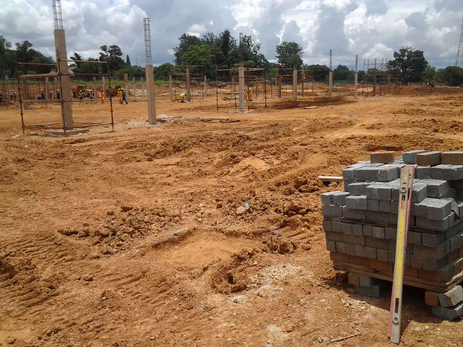 Blocks stacked on the levelled Mukuba Mall site with columns being set out