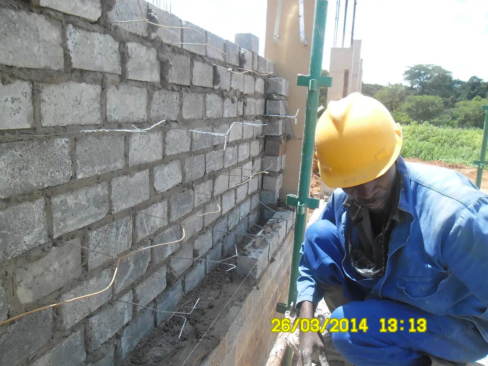 MK Production bricklayer laying blocks at Mukuba Mall