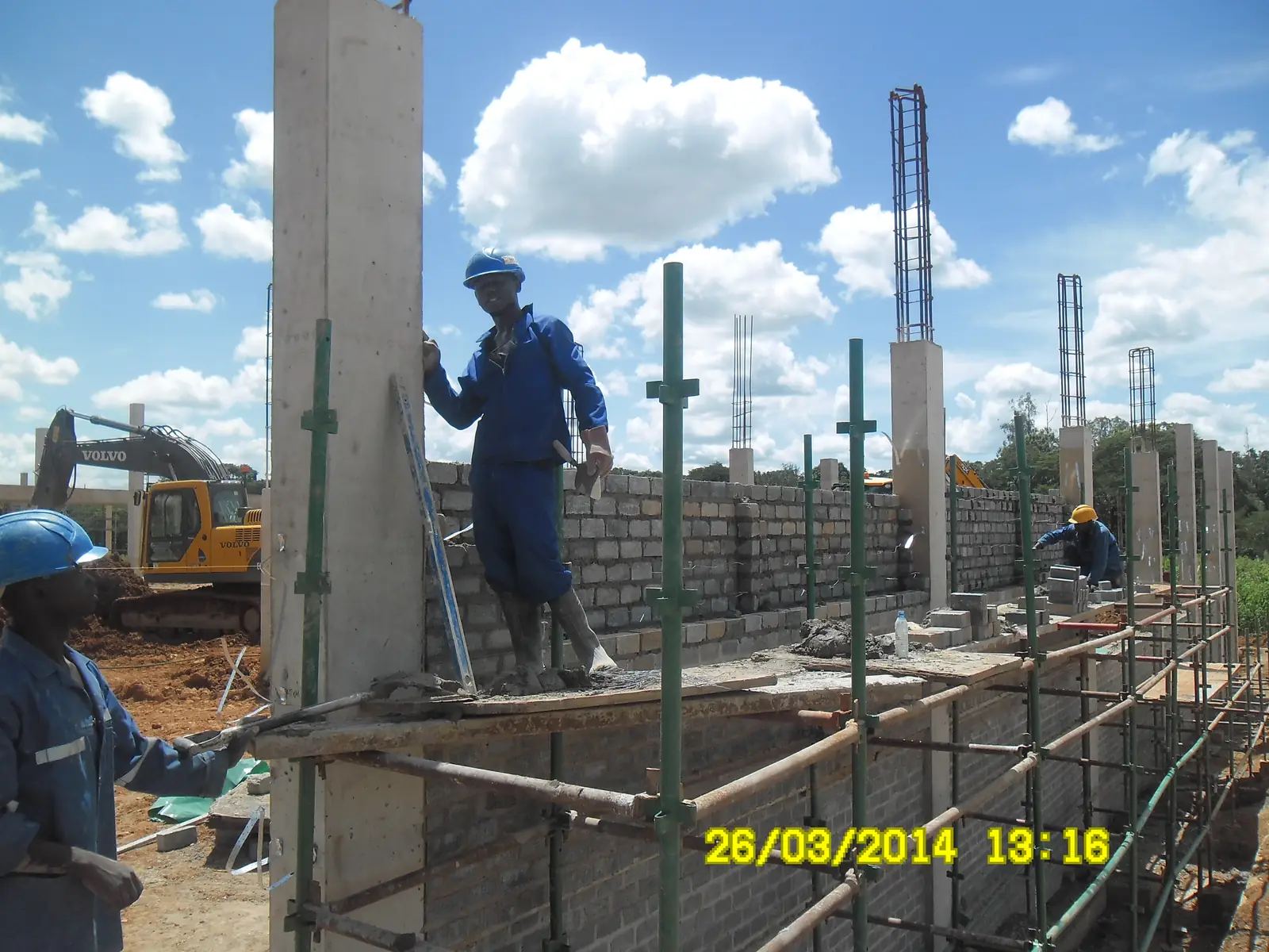 Crew on scaffolding building high walls at Mukuba Mall